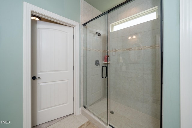 1409 Pulitzer Ln, Durham, NC 27703 - bathroom with a shower stall and tile patterned flooring