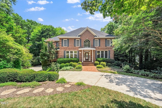 115 Loch Vale Ln, Cary, NC 27518 - colonial-style house with brick siding