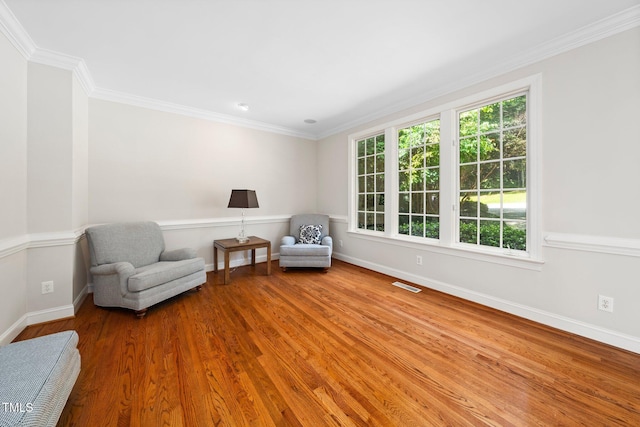 115 Loch Vale Ln, Cary, NC 27518 - sitting room with wood finished floors and crown molding