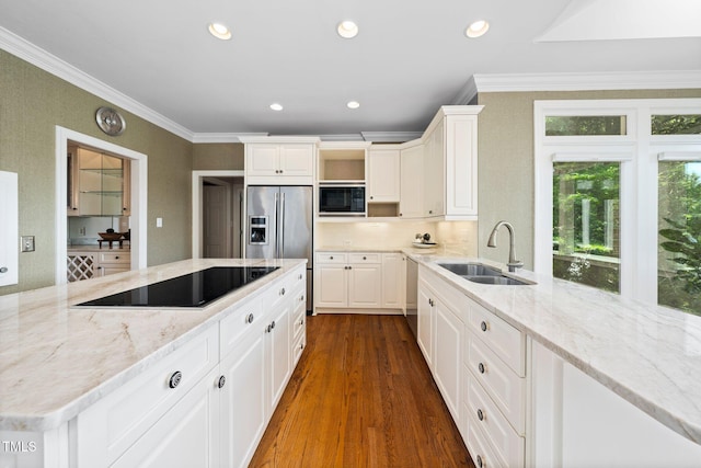 115 Loch Vale Ln, Cary, NC 27518 - kitchen featuring black appliances, ornamental molding, light stone countertops, dark wood-type flooring, and white cabinetry
