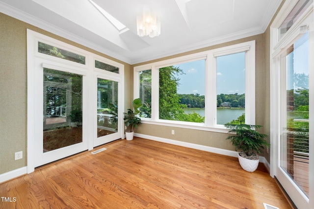 115 Loch Vale Ln, Cary, NC 27518 - unfurnished sunroom featuring ornamental molding, a skylight, a water view, and wood finished floors