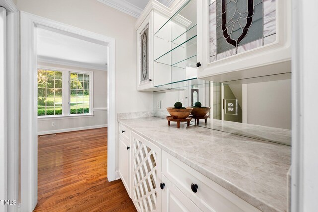 115 Loch Vale Ln, Cary, NC 27518 - bar area with ornamental molding and wood finished floors