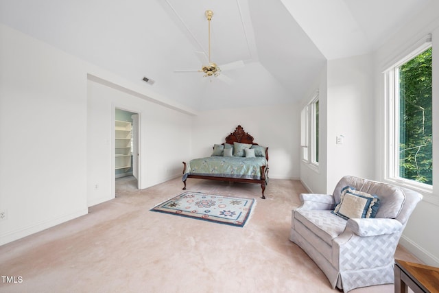 115 Loch Vale Ln, Cary, NC 27518 - bedroom featuring multiple windows, vaulted ceiling, light colored carpet, a ceiling fan, and a walk in closet