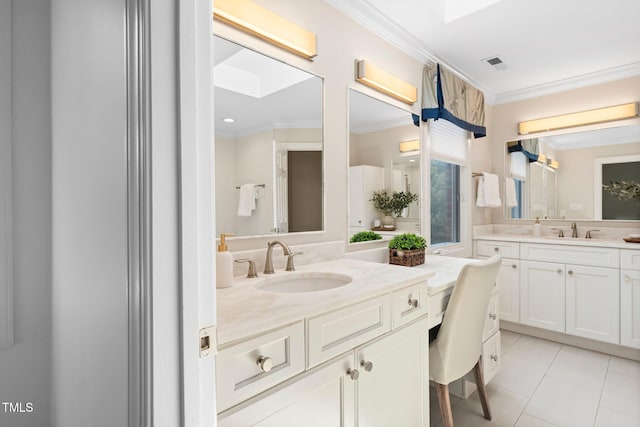 115 Loch Vale Ln, Cary, NC 27518 - full bath with ornamental molding, two vanities, and tile patterned floors