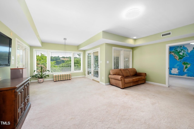 115 Loch Vale Ln, Cary, NC 27518 - living area featuring light carpet and baseboards