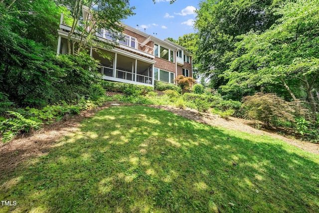 115 Loch Vale Ln, Cary, NC 27518 - view of green lawn featuring a sunroom
