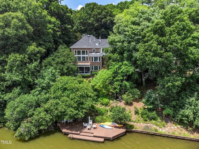 115 Loch Vale Ln, Cary, NC 27518 - view of subject property featuring a heavily wooded area and a nearby body of water