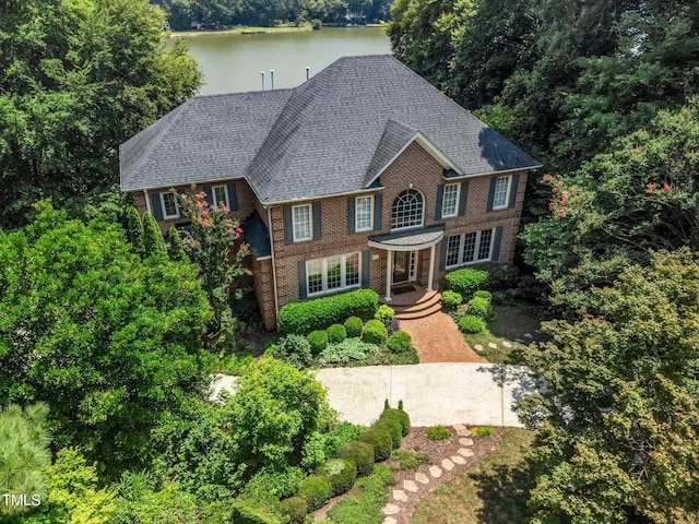 115 Loch Vale Ln, Cary, NC 27518 - view of front of property featuring brick siding, a water view, and roof with shingles