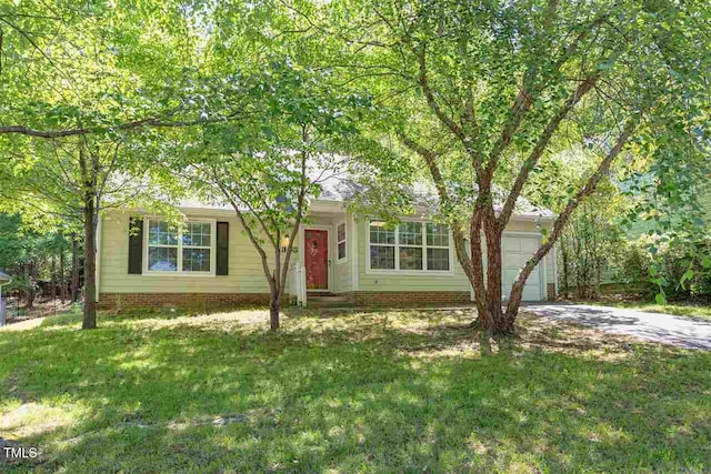 303 Saint Thomas Dr, Chapel Hill, NC 27517 - view of front of property with a garage, a front lawn, and concrete driveway