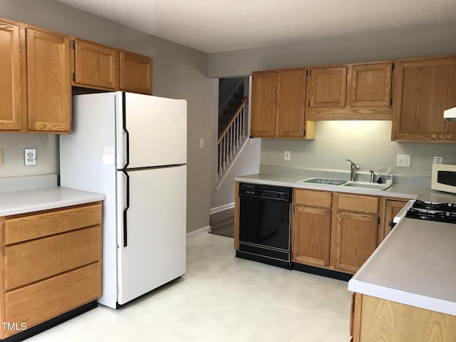 303 Saint Thomas Dr, Chapel Hill, NC 27517 - kitchen with white appliances, light floors, light countertops, and brown cabinets