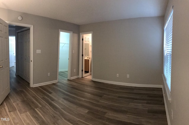 303 Saint Thomas Dr, Chapel Hill, NC 27517 - spare room featuring baseboards and dark wood finished floors