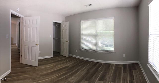 303 Saint Thomas Dr, Chapel Hill, NC 27517 - unfurnished bedroom featuring dark wood-type flooring and a closet