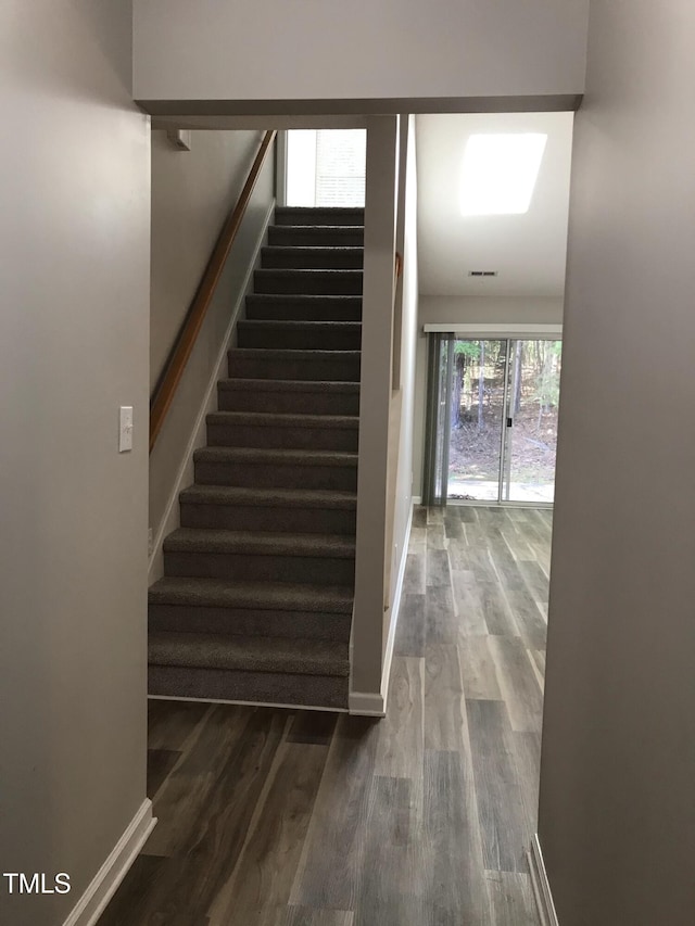 303 Saint Thomas Dr, Chapel Hill, NC 27517 - stairs featuring wood finished floors and baseboards