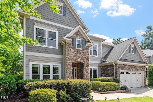 108 Holly Glen Ct, Holly Springs, NC 27540 - craftsman house with stone siding, driveway, and a garage