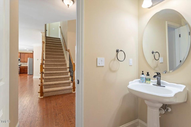108 Holly Glen Ct, Holly Springs, NC 27540 - bathroom with wood-type flooring and baseboards