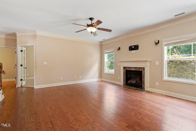 108 Holly Glen Ct, Holly Springs, NC 27540 - unfurnished living room featuring a ceiling fan, wood finished floors, a fireplace, and crown molding
