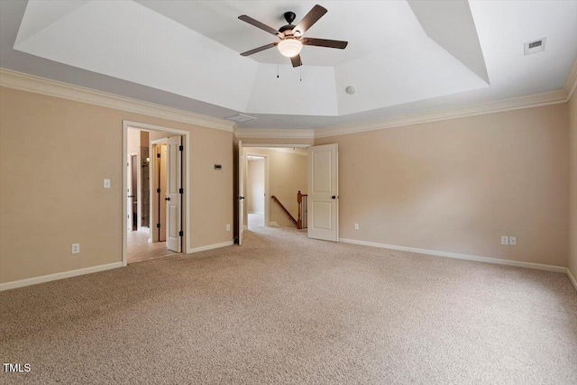 108 Holly Glen Ct, Holly Springs, NC 27540 - spare room featuring crown molding, light carpet, a ceiling fan, and a tray ceiling
