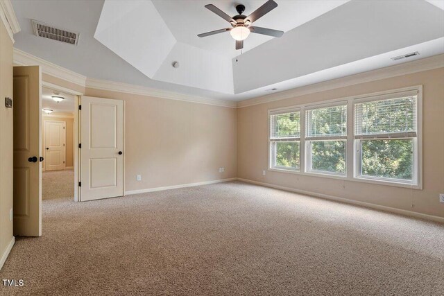 108 Holly Glen Ct, Holly Springs, NC 27540 - carpeted empty room featuring a tray ceiling, ceiling fan, and crown molding
