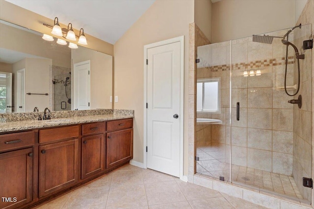 108 Holly Glen Ct, Holly Springs, NC 27540 - bathroom with vanity, a shower stall, healthy amount of natural light, and lofted ceiling