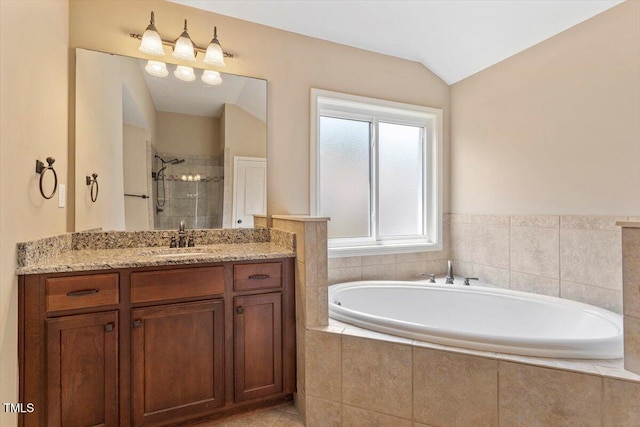 108 Holly Glen Ct, Holly Springs, NC 27540 - bathroom with vanity, a bath, a shower stall, and lofted ceiling