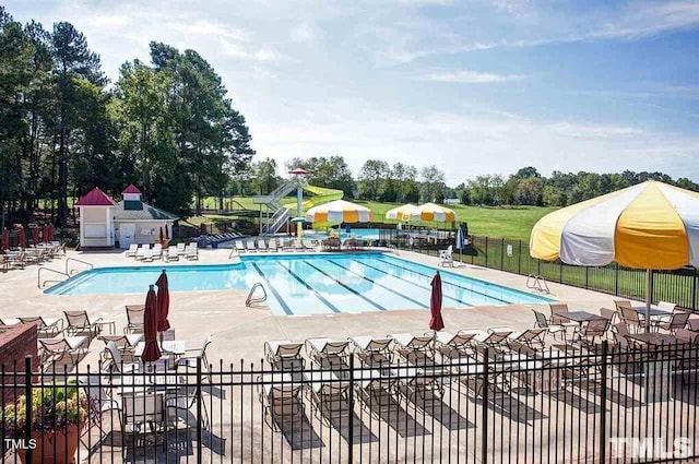 108 Holly Glen Ct, Holly Springs, NC 27540 - community pool with a patio and view of wooded area