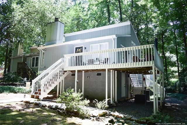 133 Bonnell Ct, Cary, NC 27511 - back of property with stairway, a wooden deck, and a chimney