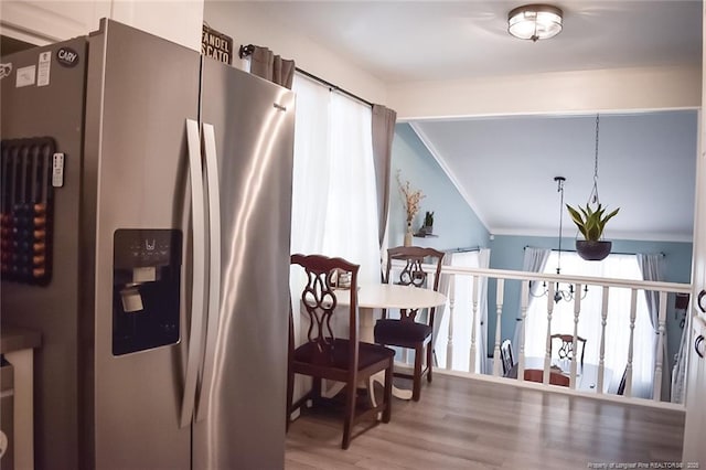 133 Bonnell Ct, Cary, NC 27511 - kitchen featuring stainless steel fridge, wood finished floors, crown molding, and vaulted ceiling