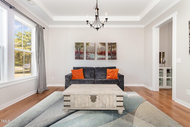 1502 Spring Overlook Ln, Hillsborough, NC 27278 - living room with a tray ceiling, a chandelier, and wood finished floors