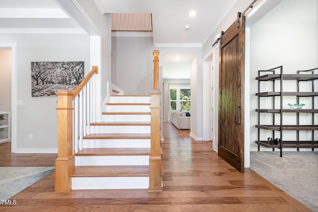 1502 Spring Overlook Ln, Hillsborough, NC 27278 - stairway with a barn door, crown molding, wood finished floors, and recessed lighting