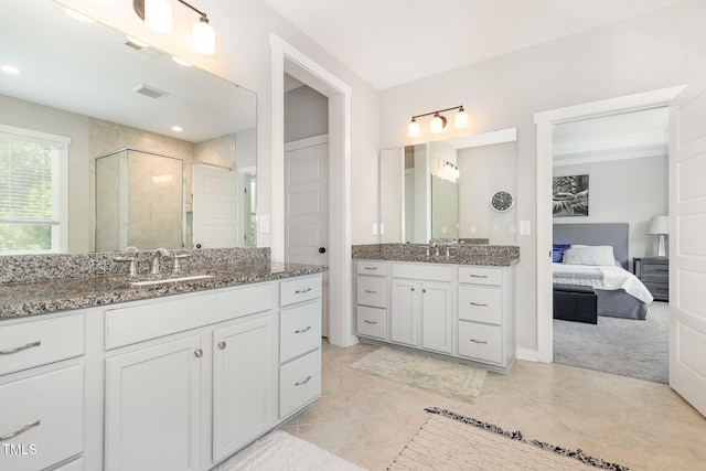 1502 Spring Overlook Ln, Hillsborough, NC 27278 - ensuite bathroom featuring a shower stall, two vanities, and tile patterned flooring