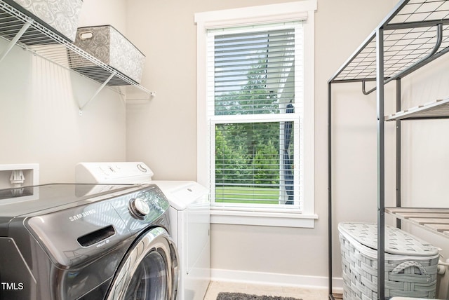 1502 Spring Overlook Ln, Hillsborough, NC 27278 - laundry area featuring separate washer and dryer, healthy amount of natural light, and tile patterned floors
