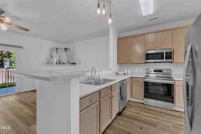 11309 Shadow Elms Ln, Raleigh, NC 27614 - kitchen with appliances with stainless steel finishes, light brown cabinetry, light wood-style flooring, ceiling fan, and a peninsula