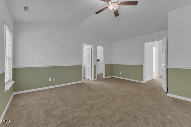 11309 Shadow Elms Ln, Raleigh, NC 27614 - spare room featuring vaulted ceiling, a ceiling fan, and carpet floors