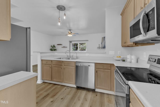 11309 Shadow Elms Ln, Raleigh, NC 27614 - kitchen with stainless steel appliances, light brown cabinets, light wood finished floors, and ceiling fan