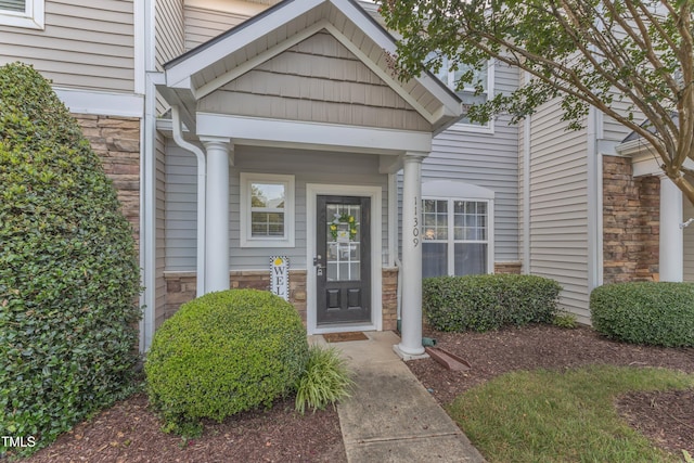 11309 Shadow Elms Ln, Raleigh, NC 27614 - property entrance featuring stone siding and covered porch
