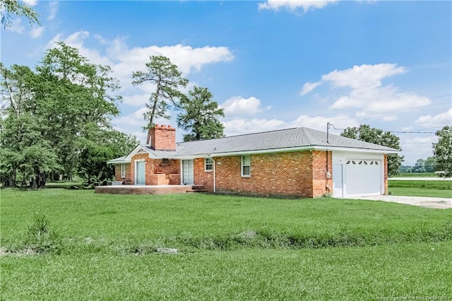 11821 N NC Highway 41, Lumberton, NC 28358 - ranch-style house with a garage, a chimney, driveway, and a front lawn