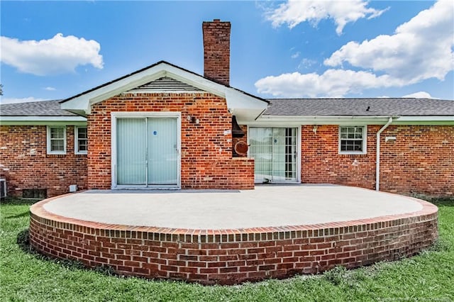 11821 N NC Highway 41, Lumberton, NC 28358 - rear view of property with a patio area, brick siding, and a chimney