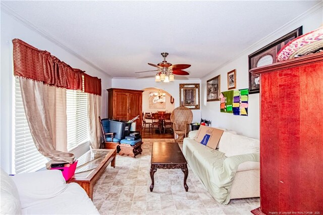 11821 N NC Highway 41, Lumberton, NC 28358 - living room featuring a ceiling fan, crown molding, and arched walkways