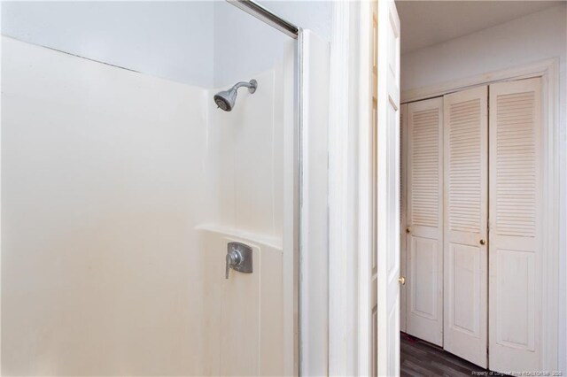 11821 N NC Highway 41, Lumberton, NC 28358 - bathroom featuring a closet, a shower, and wood finished floors