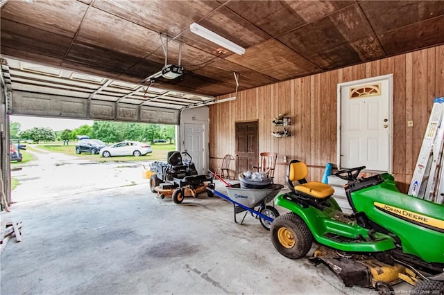 11821 N NC Highway 41, Lumberton, NC 28358 - garage featuring a garage door opener and wooden walls