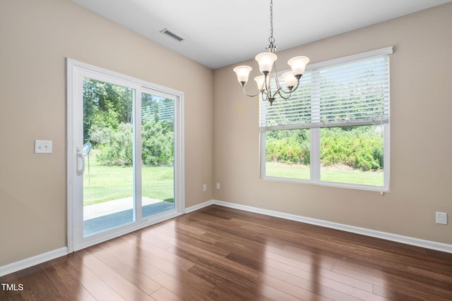 3417 Cardinal Lake Dr, Durham, NC 27704 - unfurnished room featuring a chandelier and dark wood-style floors