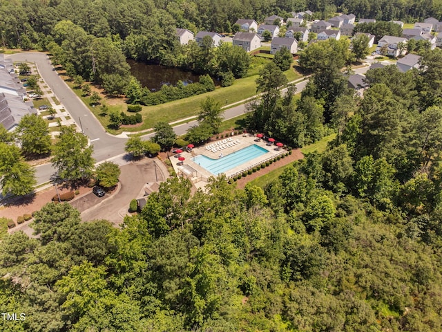 3417 Cardinal Lake Dr, Durham, NC 27704 - aerial view of a pool area and a heavily wooded area