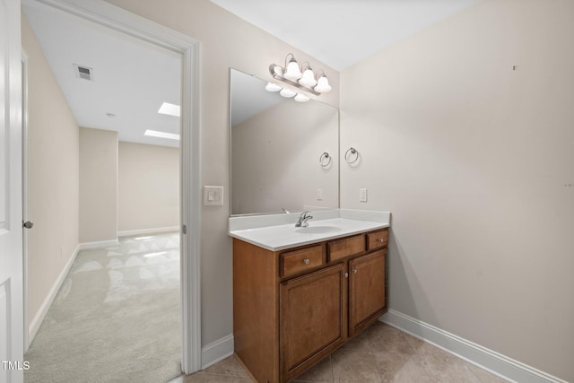 2022 Chandler Village Dr, Graham, NC 27253 - bathroom featuring a skylight and vanity