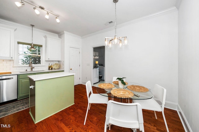 104 Homegate Cir, Apex, NC 27502 - dining room with ornamental molding, dark wood-style flooring, and a chandelier
