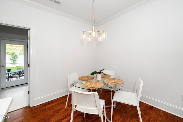 104 Homegate Cir, Apex, NC 27502 - dining room with wood finished floors, ornamental molding, and a chandelier