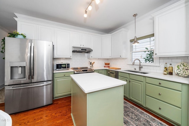 104 Homegate Cir, Apex, NC 27502 - kitchen with green cabinetry, stainless steel appliances, white cabinets, dark wood finished floors, and crown molding