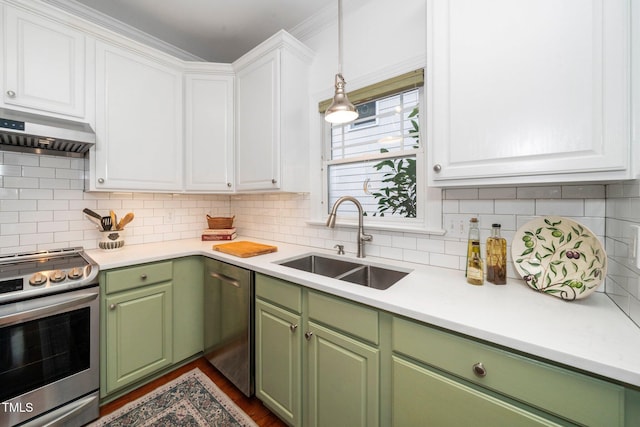104 Homegate Cir, Apex, NC 27502 - kitchen featuring appliances with stainless steel finishes, green cabinetry, white cabinetry, and ventilation hood