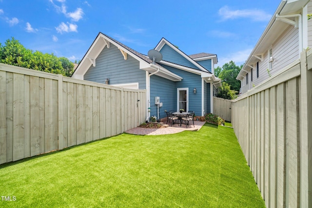 104 Homegate Cir, Apex, NC 27502 - rear view of house with a fenced backyard and a patio