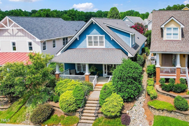 104 Homegate Cir, Apex, NC 27502 - view of front facade featuring covered porch, a shingled roof, and stairway