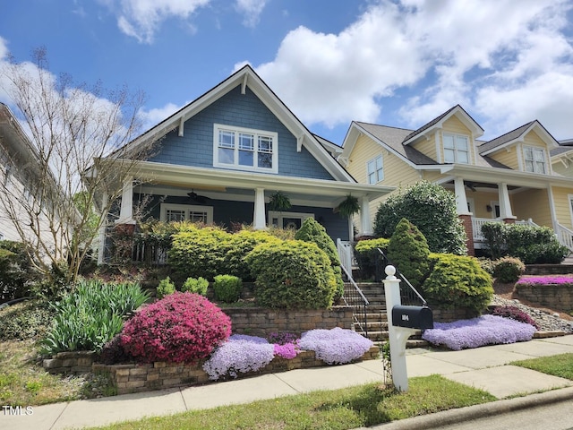 104 Homegate Cir, Apex, NC 27502 - craftsman house with a porch, ceiling fan, and stairs